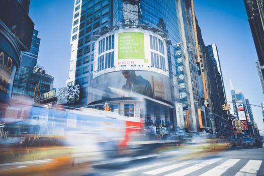 Dynamic capture of Times Square showcasing bustling city life and traffic in New York City.