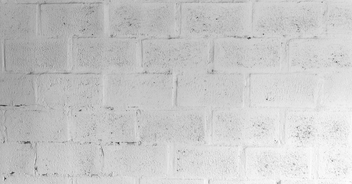 A textured white brick wall for use in design and architectural projects.