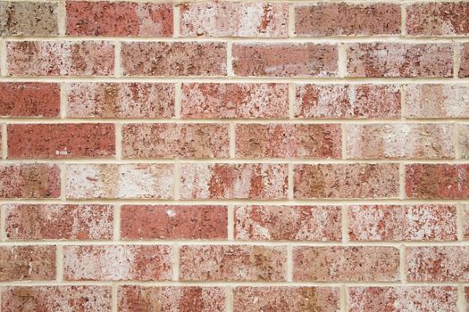 Close-up of a red and white brick wall pattern for design or background use.