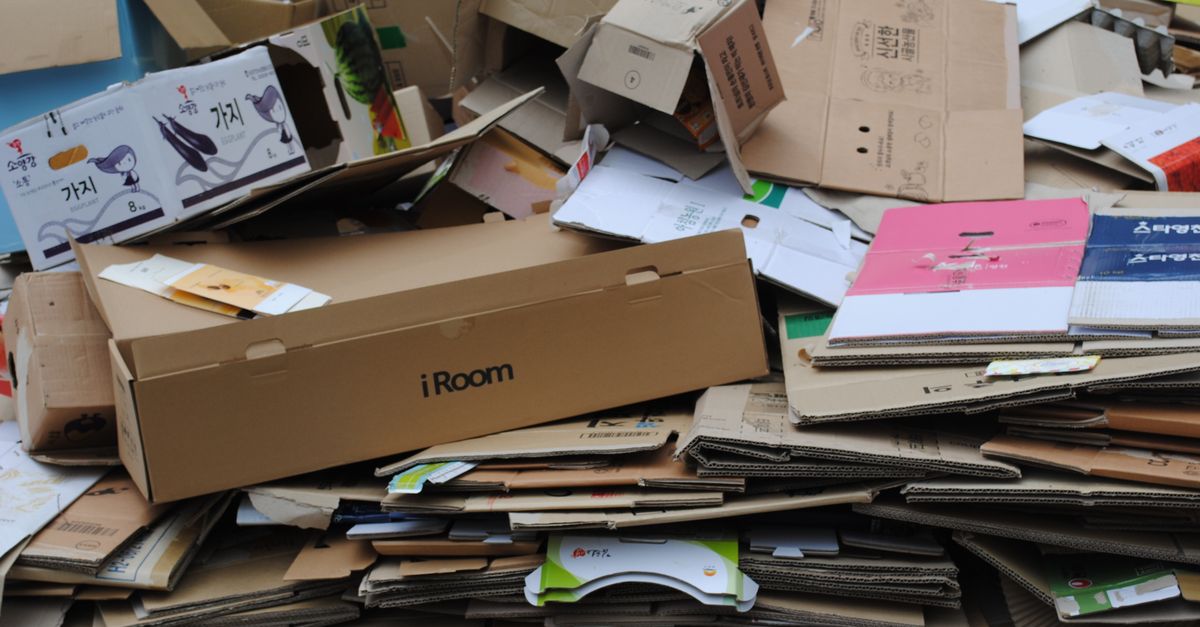 Pile of used cardboard boxes for recycling, ideal for environmental themes.