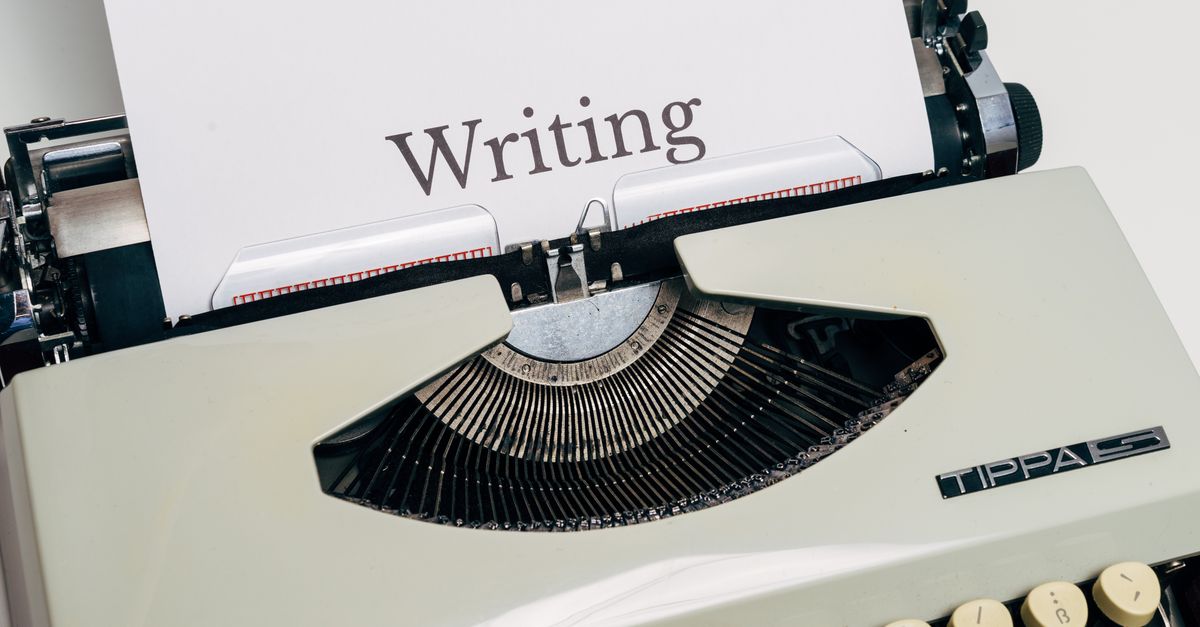 Classic vintage typewriter displaying the word 'Writing' on a sheet of paper.