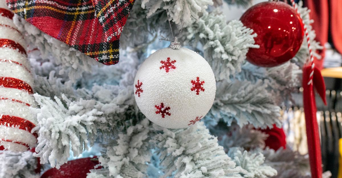 Close-up of a decorated Christmas tree with red and white ornaments, perfect for holiday decor.
