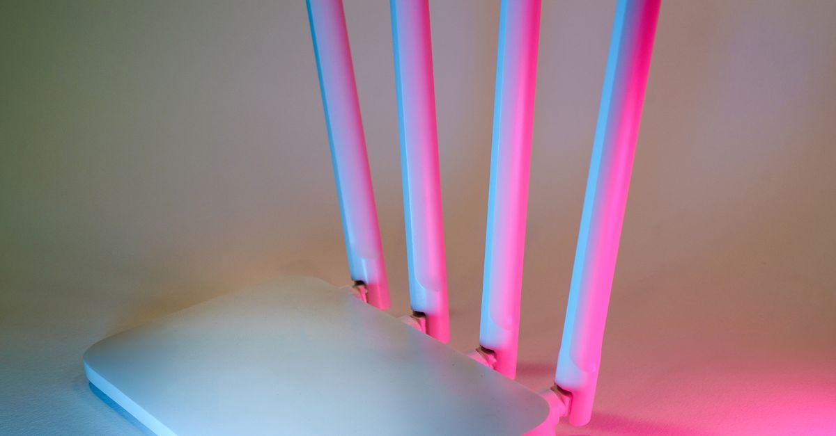 A sleek wireless router enhanced by vibrant neon lights, showcasing cutting-edge technology.