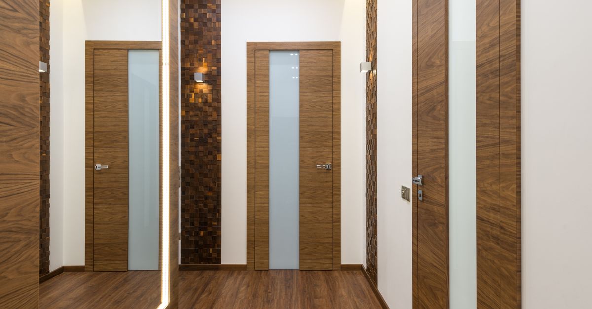 Stylish hallway featuring wooden doors and elegant design elements, perfect for modern interiors.