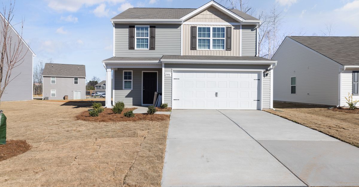 Spacious suburban family home with garage and landscaped garden.