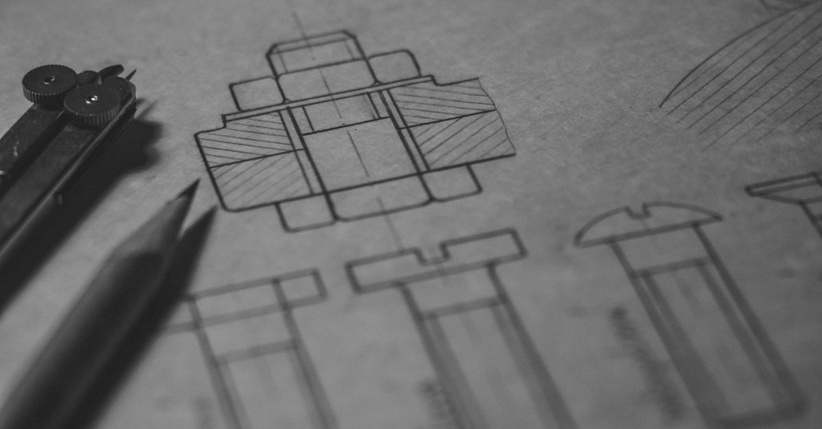 Detailed technical blueprint with pencil and compass illustrating engineering design concepts.