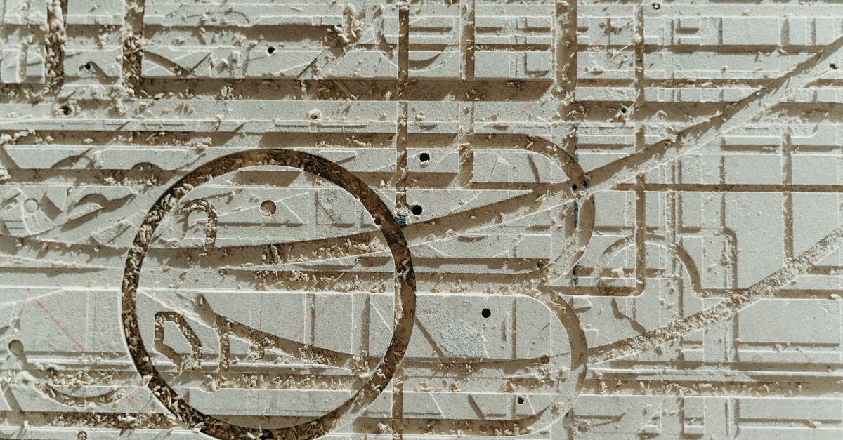 Abstract close-up of intricate carved texture on a surface, showcasing patterns and artistic details.