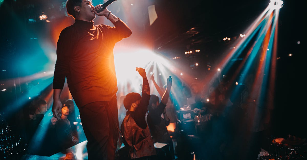 Energetic live performance with a singing artist in a vibrant nightclub atmosphere.