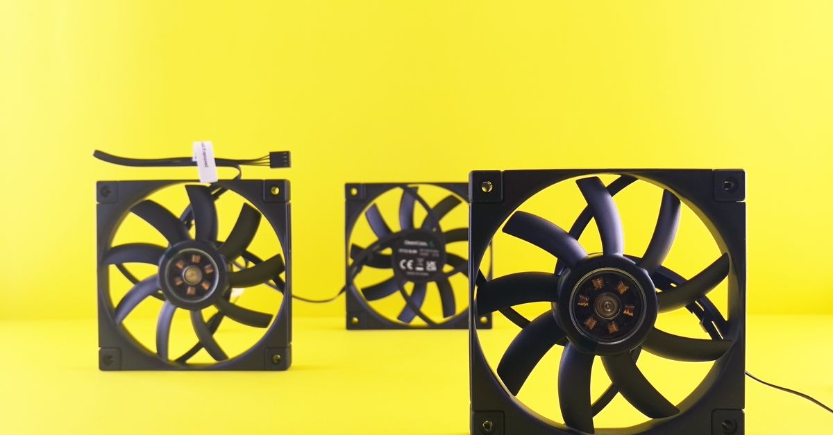 Three cooling fans are arranged on a vibrant yellow background, emphasizing tech design.