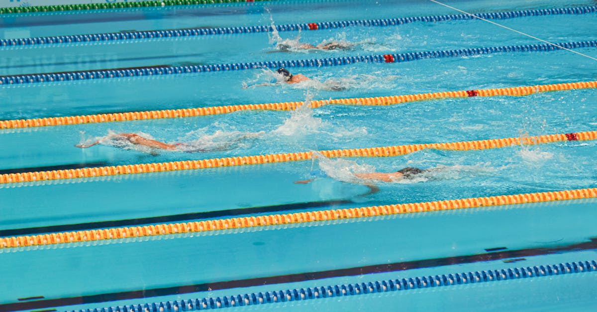Action-packed swimming competition in Jakarta pool. Swimmers racing in lanes.