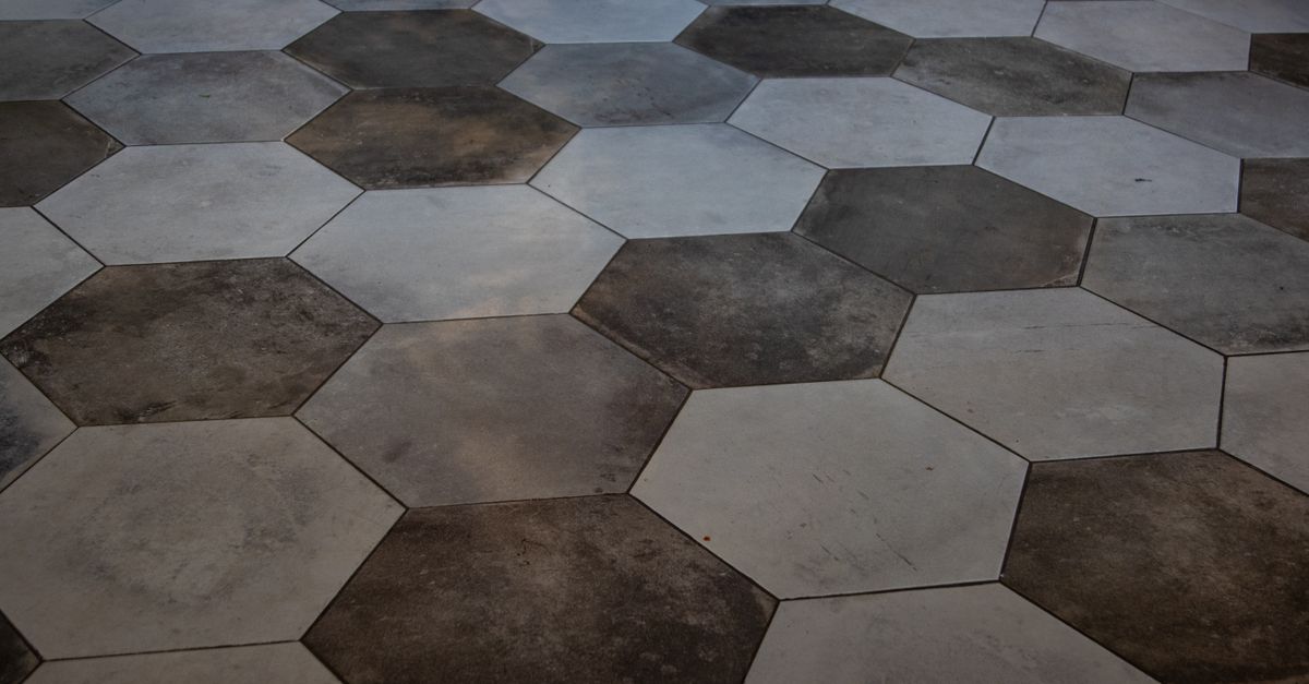 Elegant hexagonal floor tiles create a striking marble pattern, perfect for modern interiors.