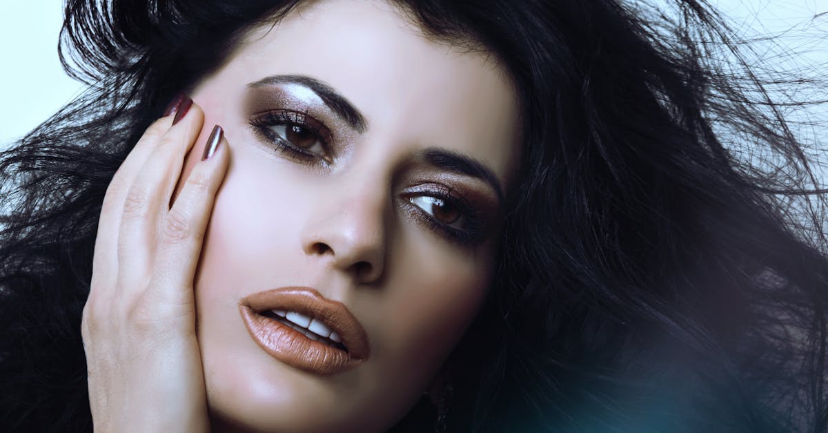 Stunning close-up portrait of a woman with glamorous makeup and captivating eyes.