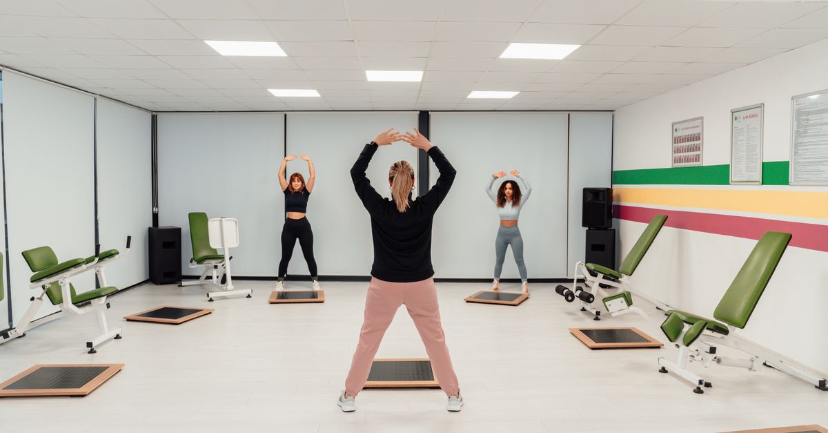 Group of women practicing pilates in an indoor gym in Yalova, Türkiye, promoting a healthy lifestyle.