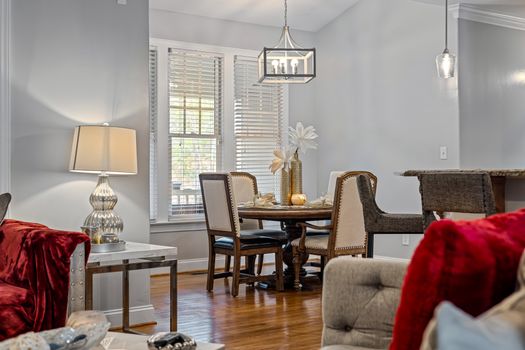 A stylish and cozy living room interior featuring a modern furniture setup and soft lighting.