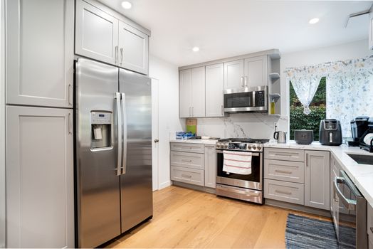 Contemporary kitchen interior featuring stainless steel appliances and sleek cabinetry.