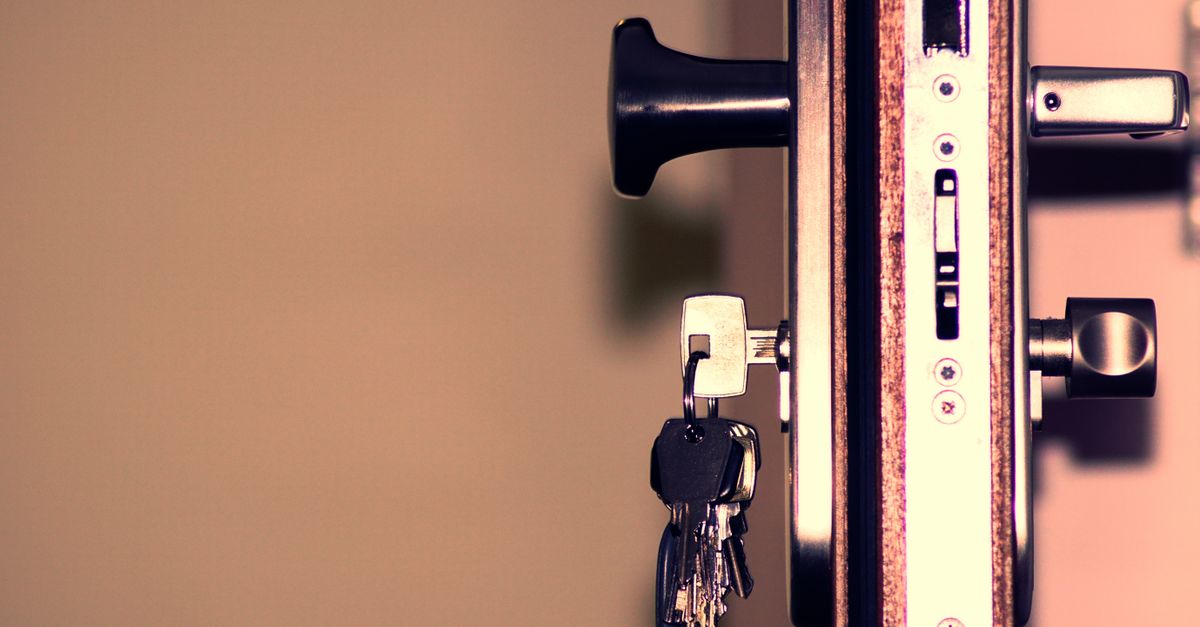 Detailed view of a door lock and keys emphasizing security and access.