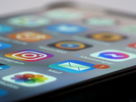 Detailed close-up of smartphone screen displaying various app icons and notifications.