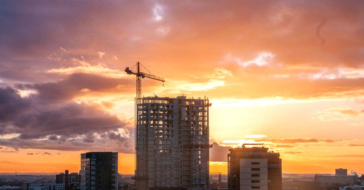 Captivating sunset scene over construction site in Manchester with dramatic skies.