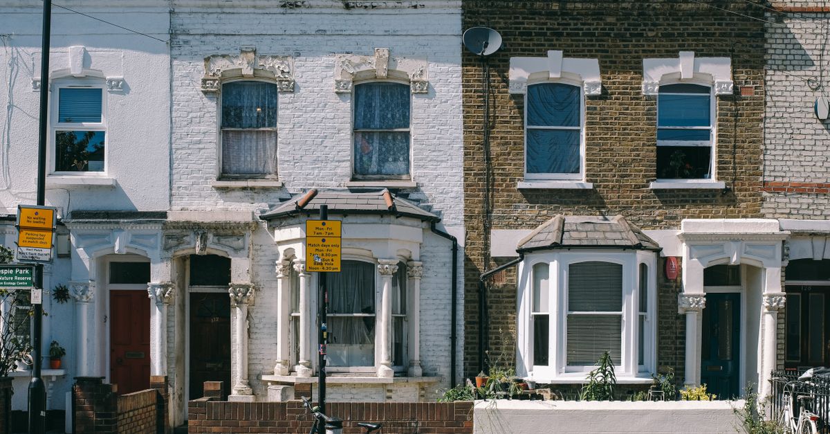 Charming vintage brick facades on a typical residential street in London, United Kingdom.