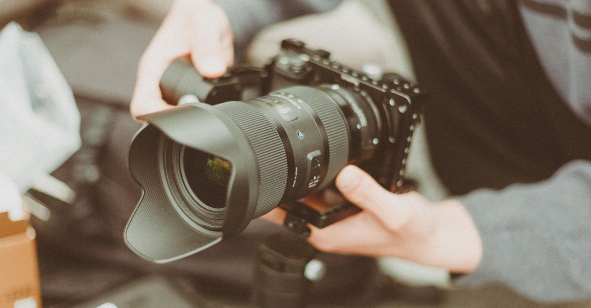 A detailed image of a modern camera with advanced lens, ideal for professional photography.