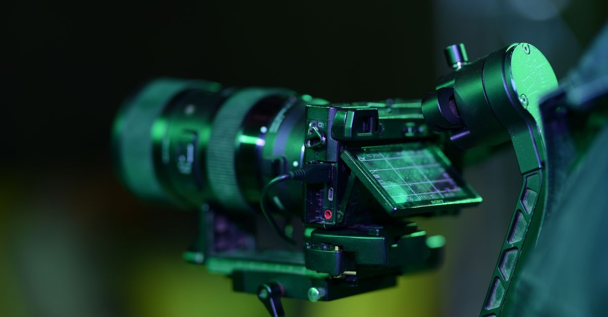 Close-up of a professional camera mounted on a gimbal. Perfect for videography and filmmaking.