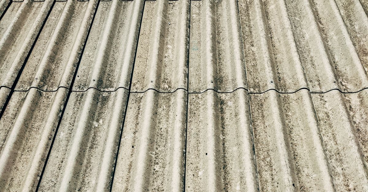 Detailed close-up of a corrugated concrete roof showcasing texture and pattern.