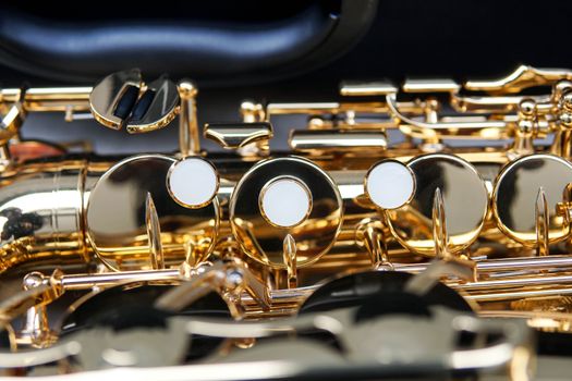 Detailed view of saxophone keys and mechanisms, highlighting craftsmanship in São Paulo, Brazil.