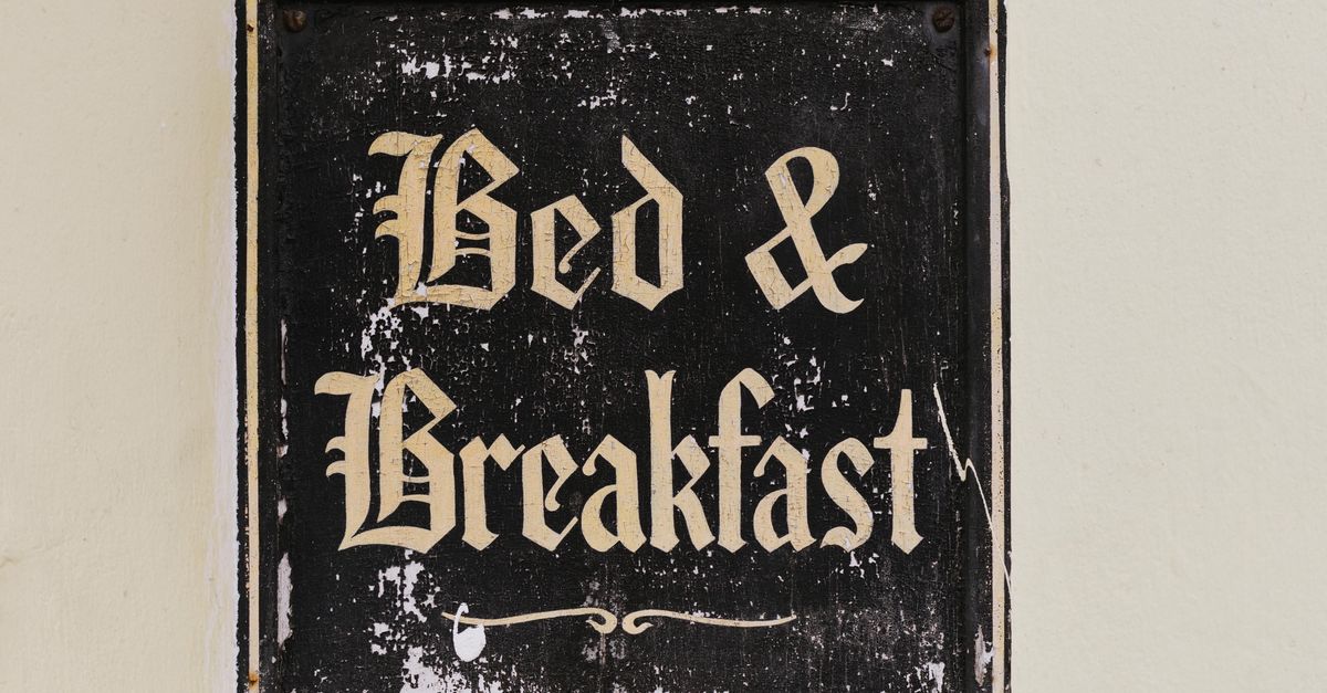 Retro sign with 'Bed & Breakfast' text, evoking nostalgia and hospitality.