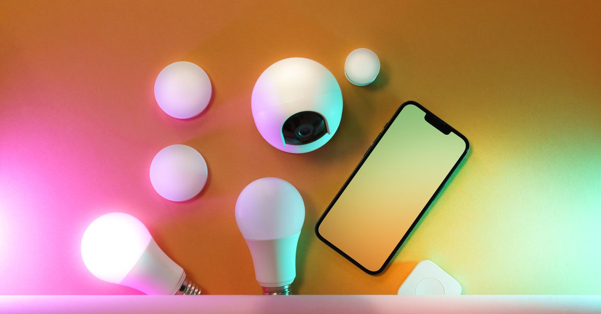 A collection of smart home devices including light bulbs and a smartphone, showcasing modern technology.