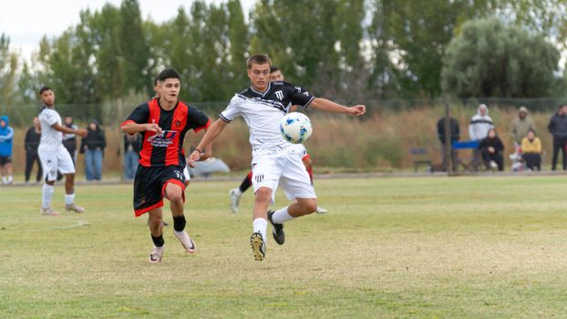 Energetic outdoor soccer match featuring young athletes competing passionately.