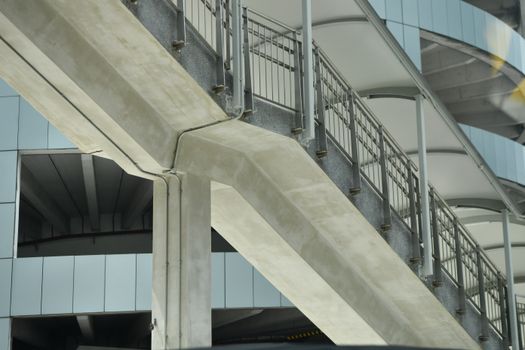 Close-up view of concrete and metal urban architecture showcasing geometric design elements.