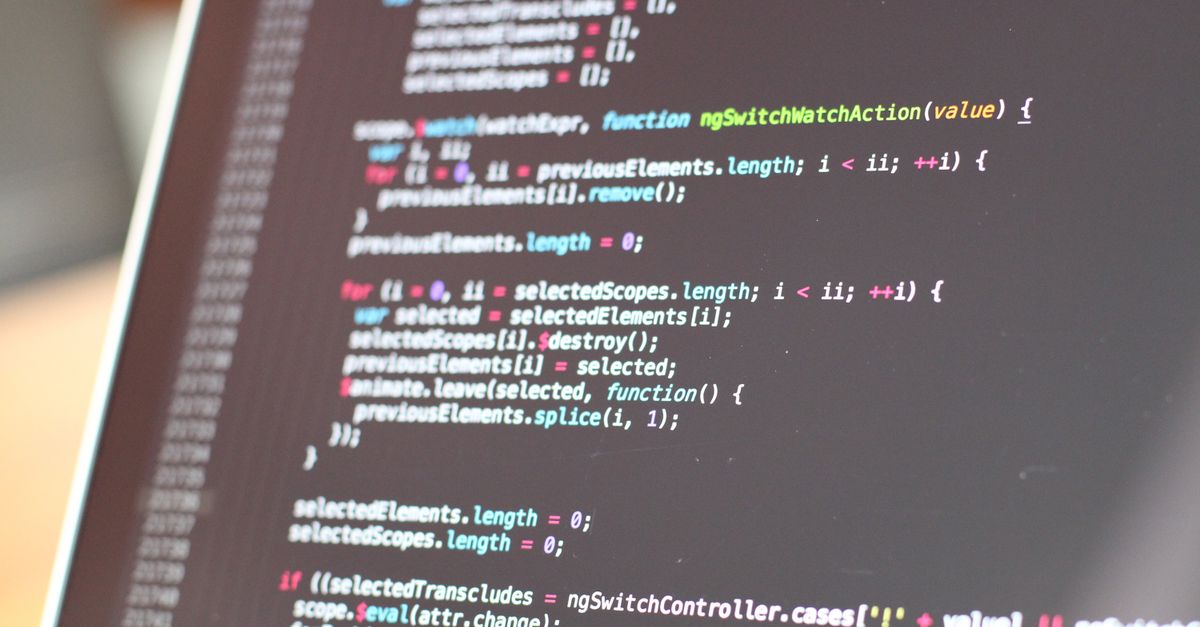 Close-up view of colorful code on a laptop screen, showcasing programming concepts.